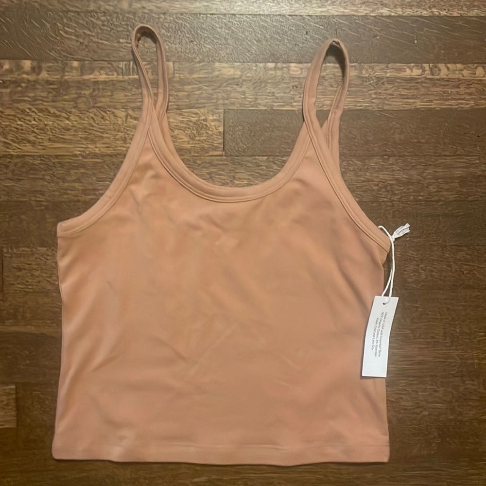 ARQ crop tank size medium. Color is mid tan.. discontinued color. New with tags